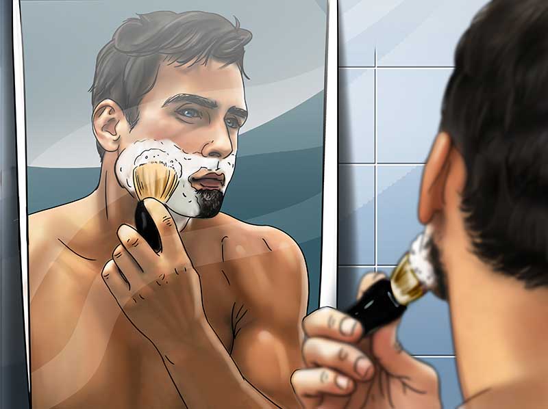 man using shaving brush to later on face